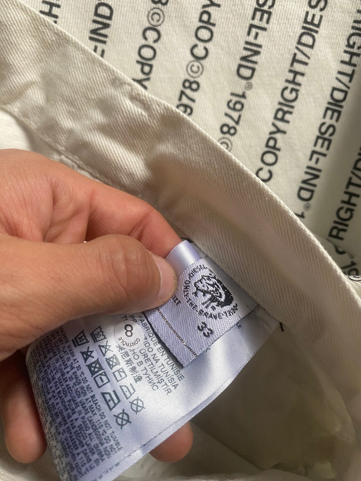 🤍 White Diesel Scripted All-Over Print Jeans – Size 33